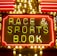 Bright neon lights on a marquee sign display the words 'RACE & SPORTS BOOK'. The sign is surrounded by rows of yellow and white lights against a red background, evoking a vibrant, energetic atmosphere typically associated with casinos or entertainment venues.